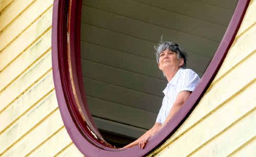 Denise Banner looks out through the hole where the rose window once stood at the Murwillumbah Catholic Hall. Denise Banner looks out through the hole where the rose window once stood at the Murwillumbah Catholic Hall.