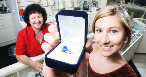Sam Kunde checks out a sapphire ring which is becoming popular among Ipswich women. Booval Hourglass Jewellers assistant manager Yvonne Otto looks on. Sam Kunde checks out a sapphire ring which is becoming popular among Ipswich women. Booval Hourglass Jewellers assistant manager Yvonne Otto looks on.