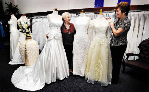 Comparing the changing style of wedding gowns over the years at Mary Vidler Bridal Gowns in Lismore are former owner Mary Vidler (left) and current Janelle Power. Comparing the changing style of wedding gowns over the years at Mary Vidler Bridal Gowns in Lismore are former owner Mary Vidler (left) and current Janelle Power.
