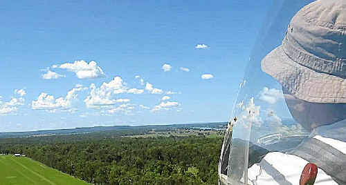 Shot with a camera outside the craft by glider/photographic enthusiast Bob King is front seat pilot Andrew Luland on the final approach to the Eatonsville airstrip. Shot with a camera outside the craft by glider/photographic enthusiast Bob King is front seat pilot Andrew Luland on the final approach to the Eatonsville airstrip.