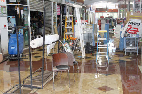 TWICE WATER DAMAGED: The Centro Market shopping centre in late January just as the cleanup effort began. cont TWICE WATER DAMAGED: The Centro Market shopping centre in late January just as the cleanup effort began. cont