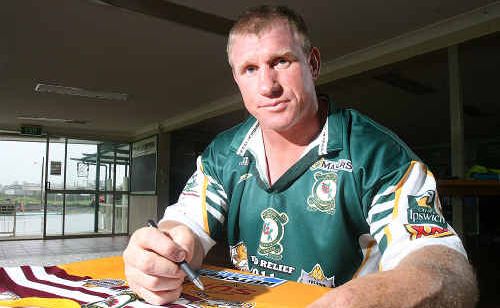Former State of Origin player Chris Beattie signs jerseys in preparation for tonight’s Legends of League game at North Ipswich Reserve. Former State of Origin player Chris Beattie signs jerseys in preparation for tonight’s Legends of League game at North Ipswich Reserve.