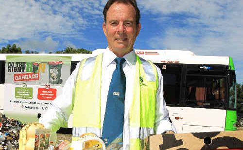 Mayor Kevin Skinner at the tip with the one of the recycling bus ads in the background. Mayor Kevin Skinner at the tip with the one of the recycling bus ads in the background.