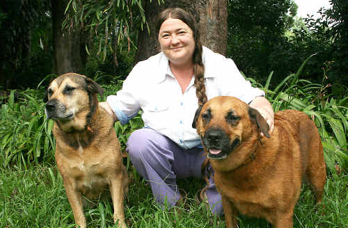 Angela Pollard, manager of the Northern Rivers Community Legal Centre, with her dogs Liz and Evie.