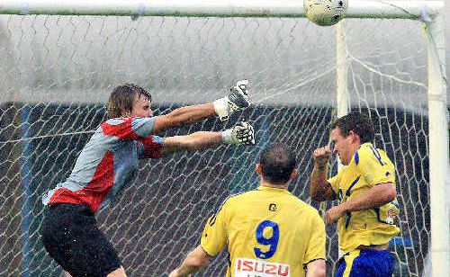 Tweed Valley Kings goalkeeper Josh Green punches the ball clear during the premier league clash against Broadbeach. Tweed Valley Kings goalkeeper Josh Green punches the ball clear during the premier league clash against Broadbeach.