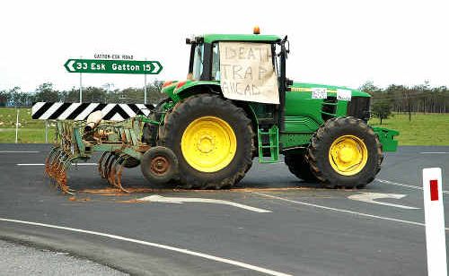 Lockyer Valley resident Rick Stevens parked his tractor at a T-intersection on Gatton-Esk Rd and Millers Rd to warn motorists of the “death trap”. Lockyer Valley resident Rick Stevens parked his tractor at a T-intersection on Gatton-Esk Rd and Millers Rd to warn motorists of the “death trap”.