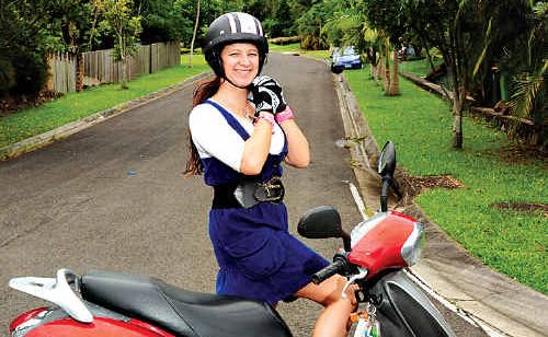 Kuluin’s Leea Gilmour loves her 50cc scooter, which she says is as cheap as chips to run. Kuluin’s Leea Gilmour loves her 50cc scooter, which she says is as cheap as chips to run.