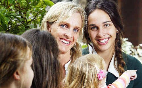 Mother of the Year finalist Michelle Covele with her natural daughter Simone and foster daughters. Mother of the Year finalist Michelle Covele with her natural daughter Simone and foster daughters.