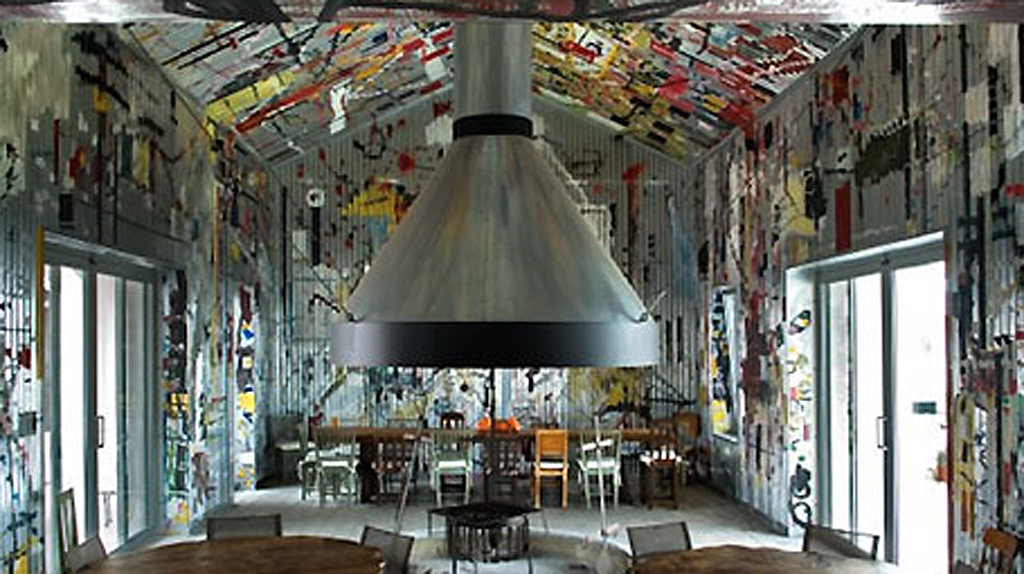 Resembling a massive tin warehouse with what seems like an endless ceiling and striking graffiti-covered walls, Estancia Vik's open barbecue room was decorated by a Uruguayan artist inspired by the nation’s gaucho shacks. Resembling a massive tin warehouse with what seems like an endless ceiling and striking graffiti-covered walls, Estancia Vik's open barbecue room was decorated by a Uruguayan artist inspired by the nation’s gaucho shacks.