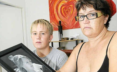 Tracey Black and son Jayke, 13, with a photo of her 15-year-old daughter who is living with her boyfriend in Batemans Bay and refuses to move to Ballina where her family now live. Doug Eaton Tracey Black and son Jayke, 13, with a photo of her 15-year-old daughter who is living with her boyfriend in Batemans Bay and refuses to move to Ballina where her family now live. Doug Eaton
