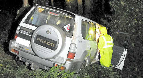 Police inspect a Toyota Prado that rolled down Bridge St and into Jubilee Park. Police inspect a Toyota Prado that rolled down Bridge St and into Jubilee Park.