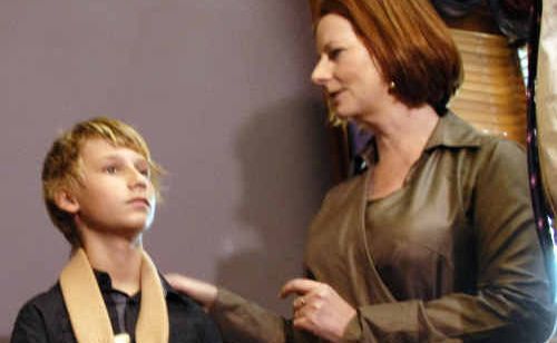 Prime Minister Julia Gillard meets with Blake Rice who wears his arm in a sling during her visit to Toowoomba. Prime Minister Julia Gillard meets with Blake Rice who wears his arm in a sling during her visit to Toowoomba.