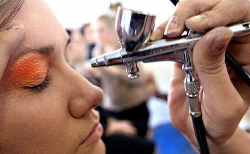 Emily Wisemantel is airbrushed by Jo Smith during a Beauty Therapy Training Australia Makeup session. Emily Wisemantel is airbrushed by Jo Smith during a Beauty Therapy Training Australia Makeup session.