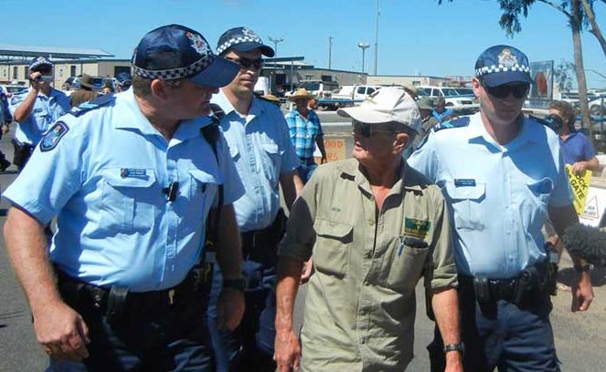 Police arrest Bob Irwin during a protest against a coal seam gas company at Tara today. Police arrest Bob Irwin during a protest against a coal seam gas company at Tara today.
