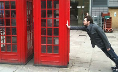 This man appears to be travelling at a remarkable speed. This is, in fact, not true. He is leaning against a phone booth. This man appears to be travelling at a remarkable speed. This is, in fact, not true. He is leaning against a phone booth.