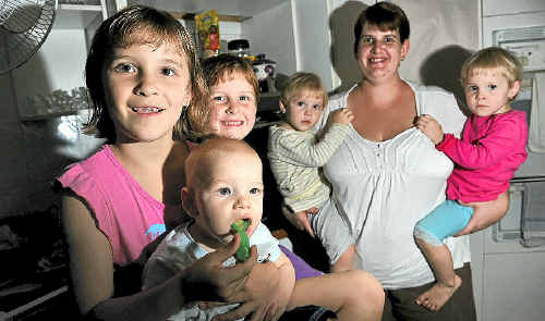 NO FOOD FIGHTS: Chloe Schick, 7, feeds her young brother Justin, eight months, while Gemma, 5, Abbey and Kara, 2, and mum Tamara look on. NO FOOD FIGHTS: Chloe Schick, 7, feeds her young brother Justin, eight months, while Gemma, 5, Abbey and Kara, 2, and mum Tamara look on.