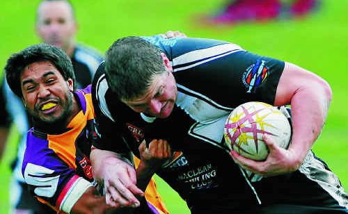 Magpie Xavier Sullivan (right) is brought to the ground by the Rhinos at McKittrick Park.Photo: Debrah Novak Magpie Xavier Sullivan (right) is brought to the ground by the Rhinos at McKittrick Park.Photo: Debrah Novak