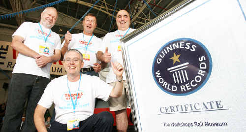 World record track builders Ted Freeman, Rod Turkington and Ray Murphy, with Workshops Rail Museum director Andrew Moritz, celebrate the official world record undertaken last year. World record track builders Ted Freeman, Rod Turkington and Ray Murphy, with Workshops Rail Museum director Andrew Moritz, celebrate the official world record undertaken last year.