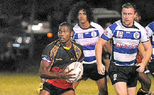 Rodrick Gela, of Woorabinda Kangaroos, looks to set up an attack against Brothers. Rodrick Gela, of Woorabinda Kangaroos, looks to set up an attack against Brothers.