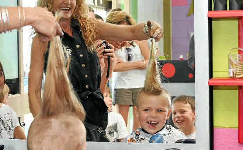 Kreative Kids Kutz Jodie Hughes shaves six-year-old Charli Harrison’s hair. Kreative Kids Kutz Jodie Hughes shaves six-year-old Charli Harrison’s hair.