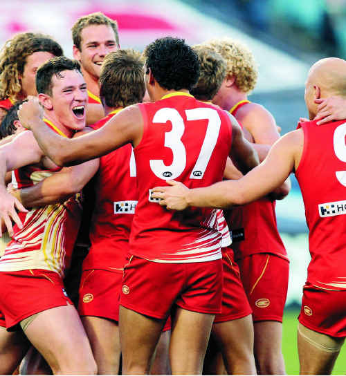 Gold Coast Suns show their feelings after recording their first win in the AFL competition. Gold Coast Suns show their feelings after recording their first win in the AFL competition.