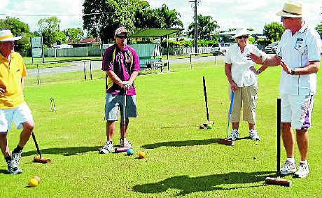 Paul Lanigan, Les Dunnet and Margaret Westbrook discuss tactics with Terry Ericson.