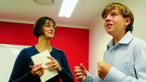 Visiting Canadian researcher Julie Orlando takes student Phillip Ranieri through singing with different emotions. Visiting Canadian researcher Julie Orlando takes student Phillip Ranieri through singing with different emotions.
