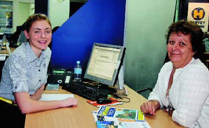 Harvey World Travel consultant Paige Kliese finalises Lynore Smith’s travel plans to Vietnam.