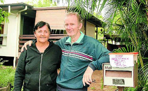 Janice and Peter Keys stand outside their mailbox, where a snake has set up camp, yesterday afternoon. Janice and Peter Keys stand outside their mailbox, where a snake has set up camp, yesterday afternoon.
