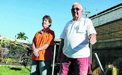 Eric Dare, right, with partner Kerry Fehlhaber, stands where his Australian flag and pole was before it was stolen. Eric Dare, right, with partner Kerry Fehlhaber, stands where his Australian flag and pole was before it was stolen.
