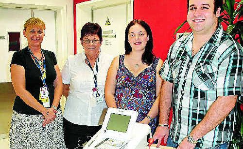 Cap Coast Hospital nurse unit manager of the Women and Family Program, Susan Campbell (left), and midwife and child health nurse Cheryl Smith, with Jennie and Adam Diefenbach, with the new CTG machine. Cap Coast Hospital nurse unit manager of the Women and Family Program, Susan Campbell (left), and midwife and child health nurse Cheryl Smith, with Jennie and Adam Diefenbach, with the new CTG machine.