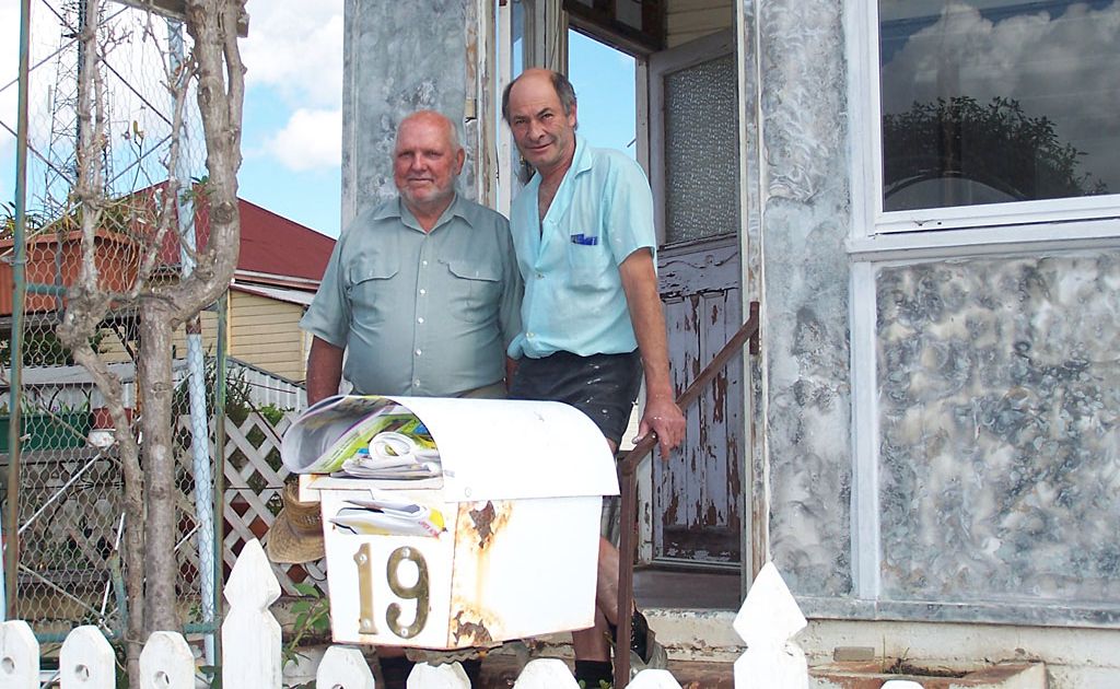 A perplexed Dixie Gibson and son-in-law Norm Self at their flood-affected home. A perplexed Dixie Gibson and son-in-law Norm Self at their flood-affected home.