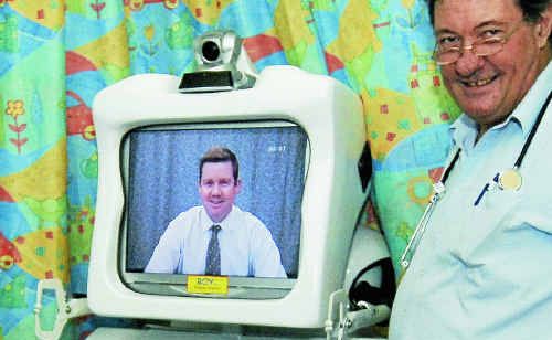 Roy the Robot has been installed at Gladstone Hospital. One screen is Dr Anthony Smith. Beside Roy is Dr Bob McCrossin. Roy the Robot has been installed at Gladstone Hospital. One screen is Dr Anthony Smith. Beside Roy is Dr Bob McCrossin.