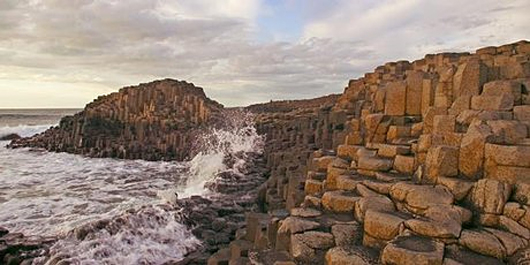 The Giant's Causeway in County Antrim - the result of an ancient volcanic eruption - sets a magical tone for its wild and wind-lashed coast.