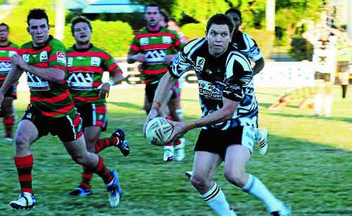 Easts’ Nigel Shield sends the ball to a support player in the A-grade match against Hervey Bay at Salter Oval on Saturday. Easts’ Nigel Shield sends the ball to a support player in the A-grade match against Hervey Bay at Salter Oval on Saturday.