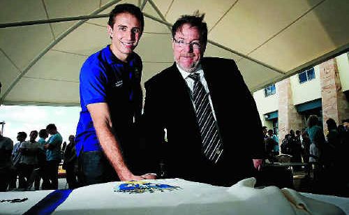 Student Association president James Graham and Deputy Vice Chancellor Garry Marchant cut the giant cake. Student Association president James Graham and Deputy Vice Chancellor Garry Marchant cut the giant cake.