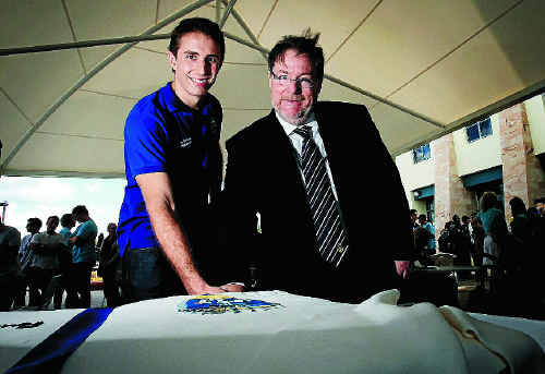 Student Association president James Graham and Deputy Vice Chancellor Garry Marchant cut the giant cake. Student Association president James Graham and Deputy Vice Chancellor Garry Marchant cut the giant cake.