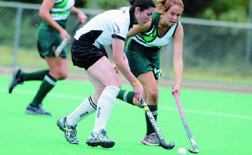 Hockey rivals battle for possession. Hockey rivals battle for possession.