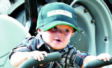 Alex Berginey, of Rural View, tries out the machinery on display.