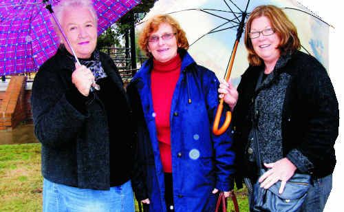 (From left) Philomena Aspinall, Suzanne Ridley and Dorothy Haig had their brollies at the ready before yesterday’s historic coach tour. (From left) Philomena Aspinall, Suzanne Ridley and Dorothy Haig had their brollies at the ready before yesterday’s historic coach tour.
