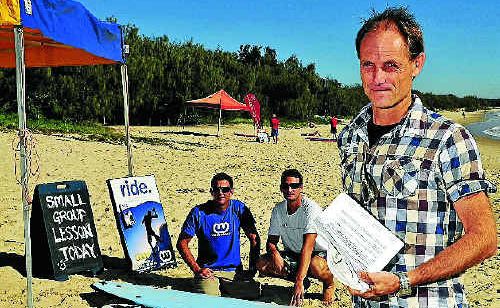 Wavesense Principal Ross Phillips (front ) and instructors Tim Mitchell and James Howard-Clarke are in dispute with council over permits. Wavesense Principal Ross Phillips (front ) and instructors Tim Mitchell and James Howard-Clarke are in dispute with council over permits.
