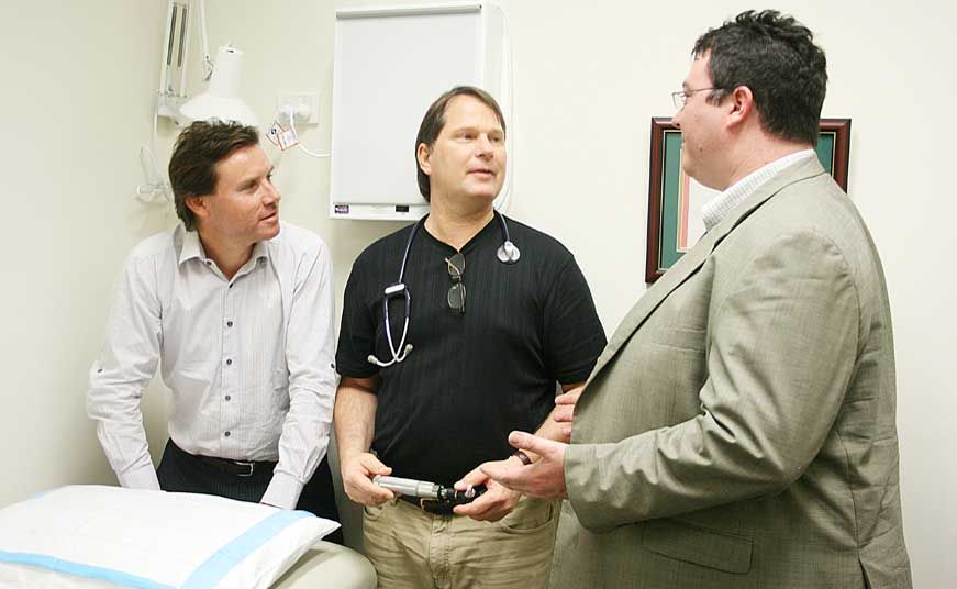 TALKS OF FUNDING: Shadow Parliamentary Secretary for Regional Health Services and Indigenous Health Andrew Laming and Federal member for Dawson George Christensen chat with Cannonvale Medical Centre doctor Michael McFall (centre) about the importance of gaining federal health funding for the area. TALKS OF FUNDING: Shadow Parliamentary Secretary for Regional Health Services and Indigenous Health Andrew Laming and Federal member for Dawson George Christensen chat with Cannonvale Medical Centre doctor Michael McFall (centre) about the importance of gaining federal health funding for the area.