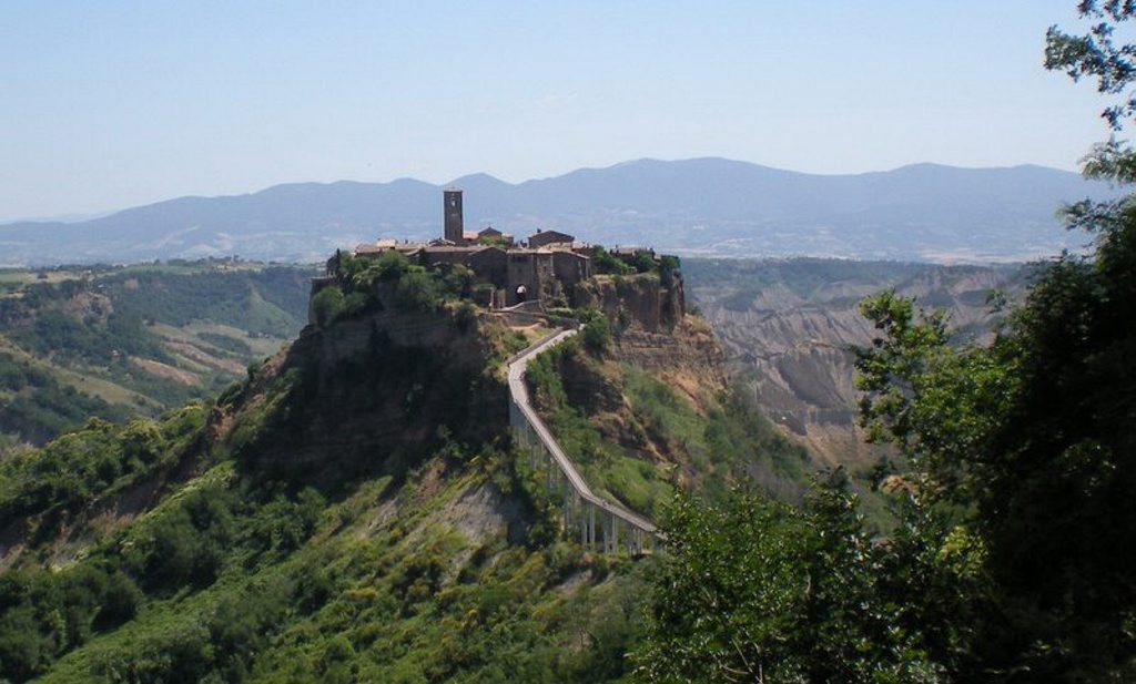 Civita di Bagnoregio is separated from the rest of the region by a long walkway. Civita di Bagnoregio is separated from the rest of the region by a long walkway.