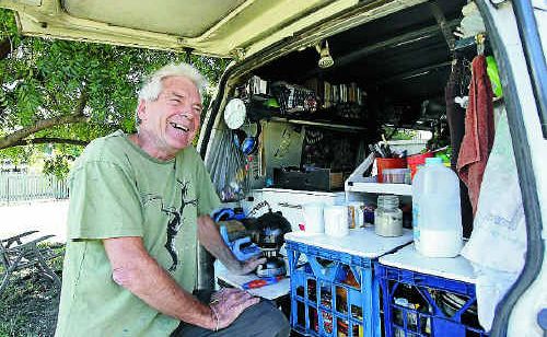 Peace campaigner Graeme Dunstan makes a brew in the back of his Peacebus from where he is co-ordinating protests against operation Talisman Sabre. Peace campaigner Graeme Dunstan makes a brew in the back of his Peacebus from where he is co-ordinating protests against operation Talisman Sabre.