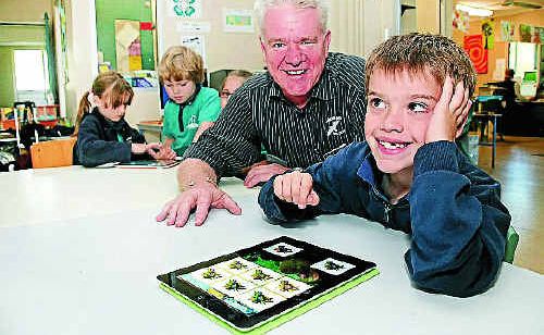 Noosaville State School student Ben Mawn shows his delight in one of the new iPads with Tewantin-Noosa RSL chief executive officer Phil Stephenson. Noosaville State School student Ben Mawn shows his delight in one of the new iPads with Tewantin-Noosa RSL chief executive officer Phil Stephenson.