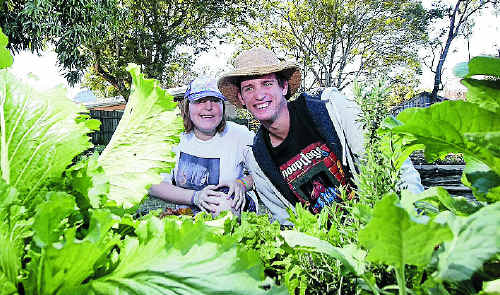 Jessica Watego and Cambell Woodfield love to get their hands dirty at the Wandal Community Garden, where there will be a free community barbecue today. Jessica Watego and Cambell Woodfield love to get their hands dirty at the Wandal Community Garden, where there will be a free community barbecue today.