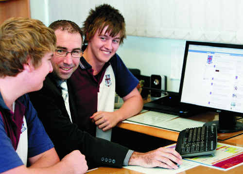 Mackay State High School student Steven Ruhle, deputy principal Cameron Wayman and student Lachlan Forsyth look at the school’s new Facebook page.. Mackay State High School student Steven Ruhle, deputy principal Cameron Wayman and student Lachlan Forsyth look at the school’s new Facebook page..