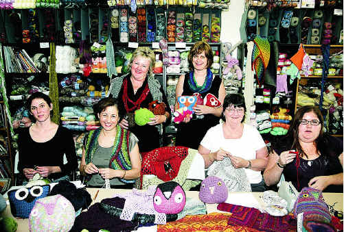 Sarah Neill, Diane Arden, Beverley Hubbard and Joanne Nissen help Jenny King Designs owners Jenny King and Leah Hyndman crochet owls for children in foster care.