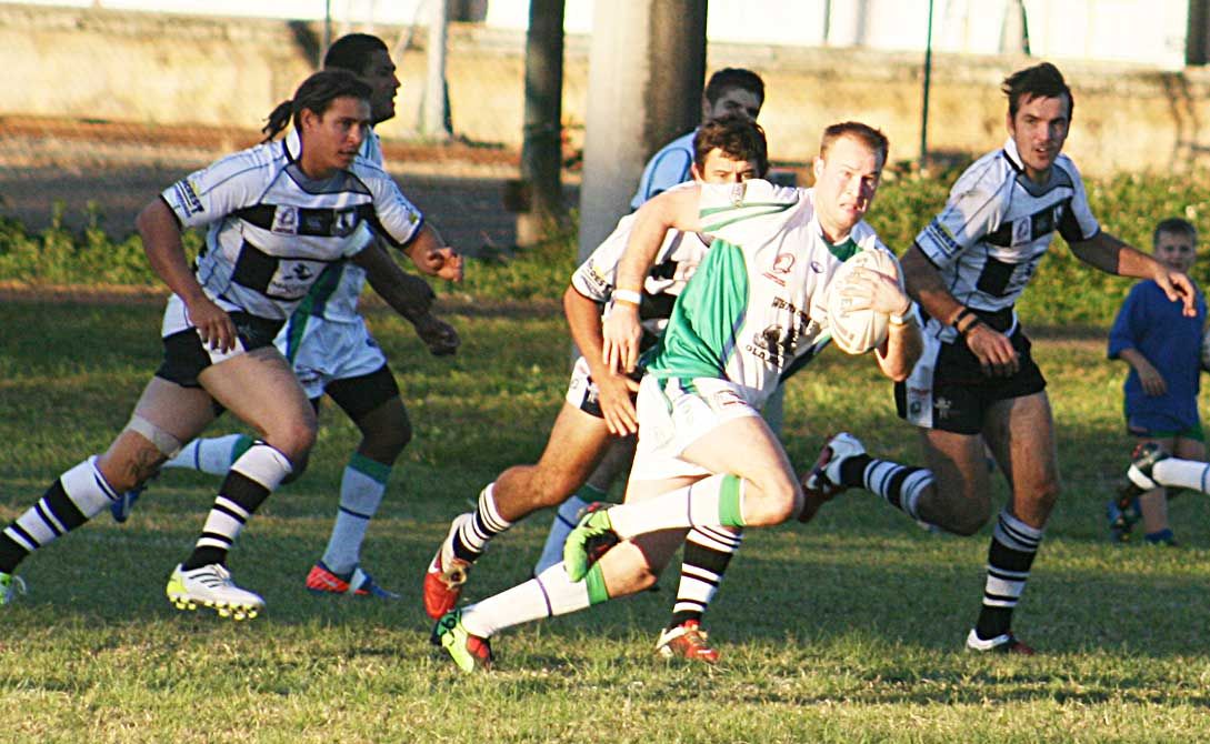 KEEP ON GOING: Proserpine Brahmans player Matty Lade looks ahead as Magpie players catch-up to him at last Saturdays match at Les Stagg Oval. KEEP ON GOING: Proserpine Brahmans player Matty Lade looks ahead as Magpie players catch-up to him at last Saturdays match at Les Stagg Oval.