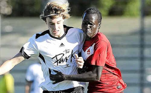 Byron Bay clashed with Lismore Workers at Oakes Oval on Saturday, where Nolan Pierce and Baitok Ring fought over the ball. Byron Bay clashed with Lismore Workers at Oakes Oval on Saturday, where Nolan Pierce and Baitok Ring fought over the ball.
